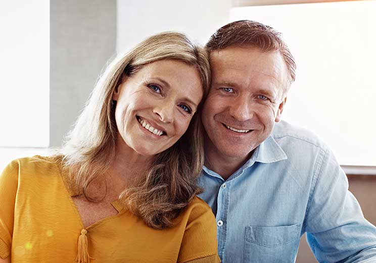 Image show a couple smiling