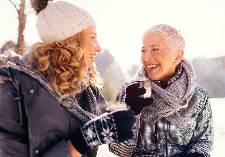 Image show two women have a coffee outdoor