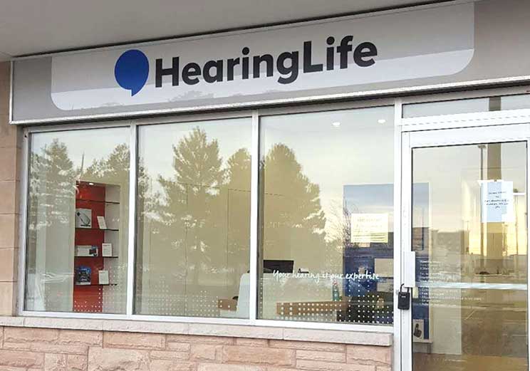 HearingLife hearing center storefront with large windows and company signage