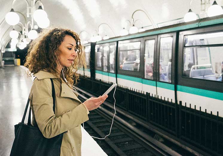 Image show woman have a call at a trainstation