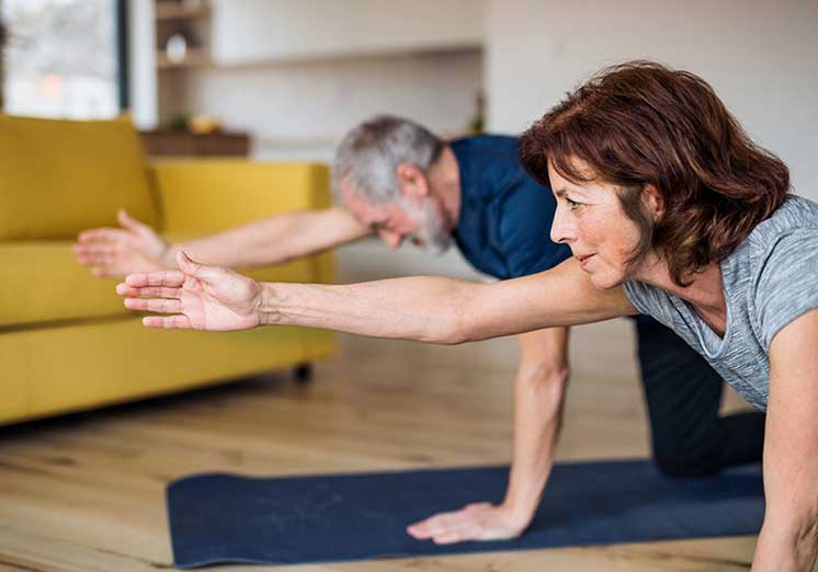 Image show man and woman doing yoga
