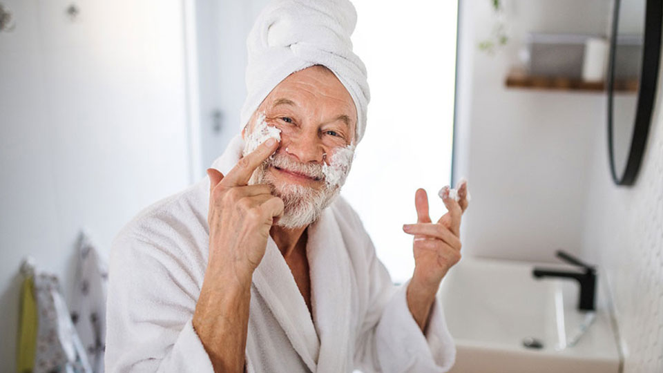 Man having fun with a face mask