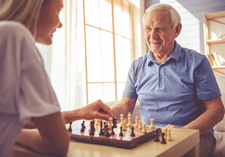 Image show couple playing chess