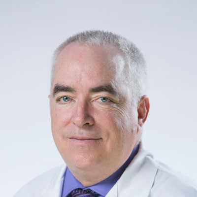 Daniel Allen, hearing care specialist in professional attire.