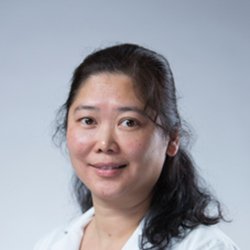 Ida Tsui, hearing care professional, wearing a white coat against a neutral background
