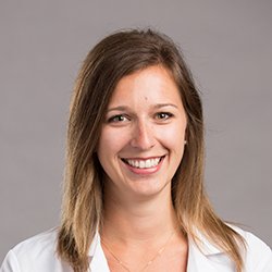 Jennifer Gilson, hearing care specialist, with shoulder-length blonde hair wearing a white coat.