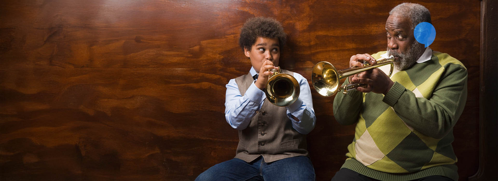 grandfather and grandson playing music