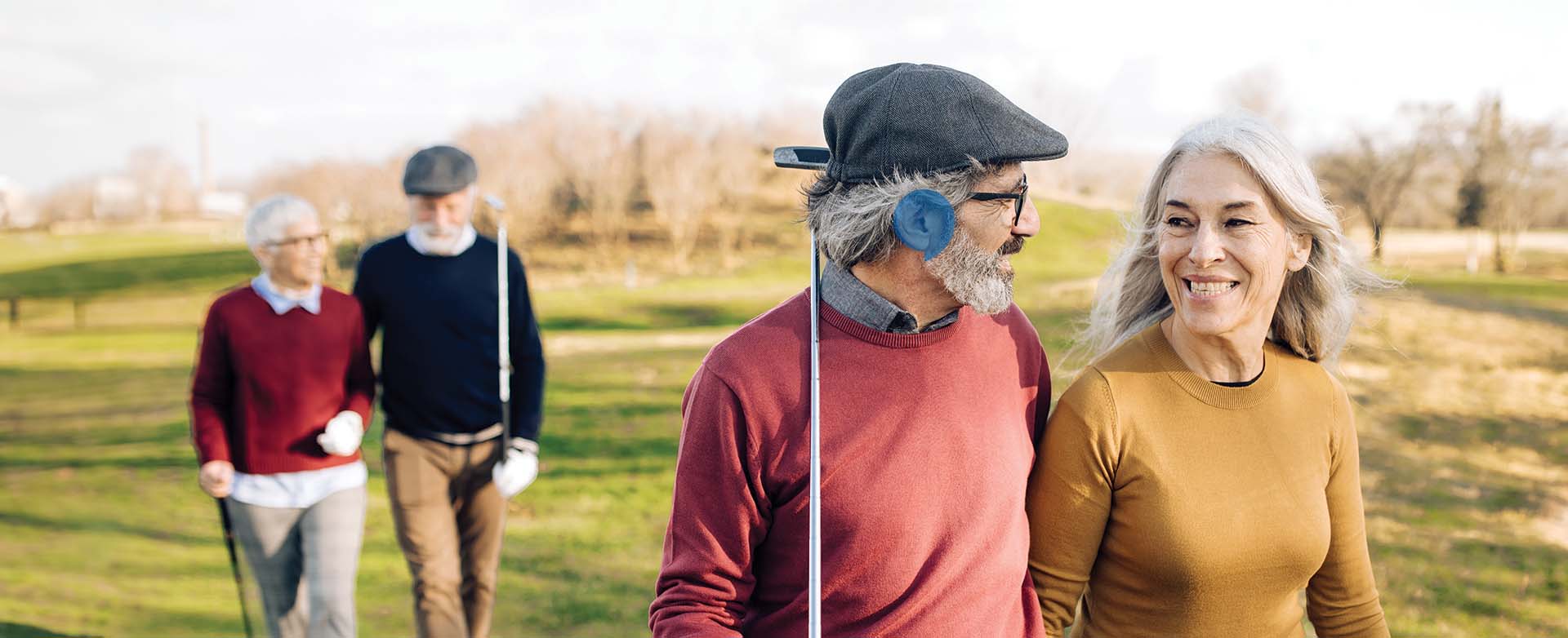 man and woman playing golf