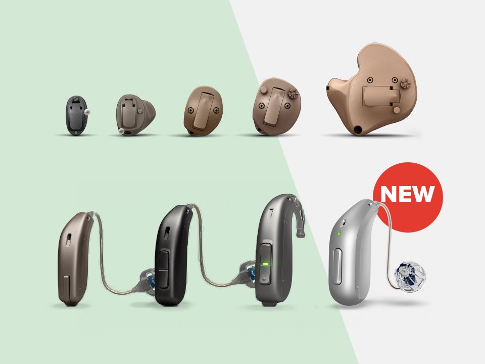 The image showcases a variety of hearing aids, including in-the-ear and behind-the-ear models, positioned on a split green-and-white background. A ’NEW’ label highlights a sleek silver hearing aid. No visible brand names are shown, but the designs suggest advanced hearing care technology typical of providers like HearingLife.