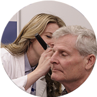 Audiologist examining a patient's ears