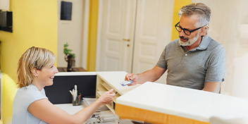 Paying for hearing aids at a clinic reception