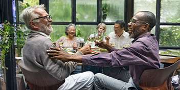 friends enjoying dinner and lively conversation together