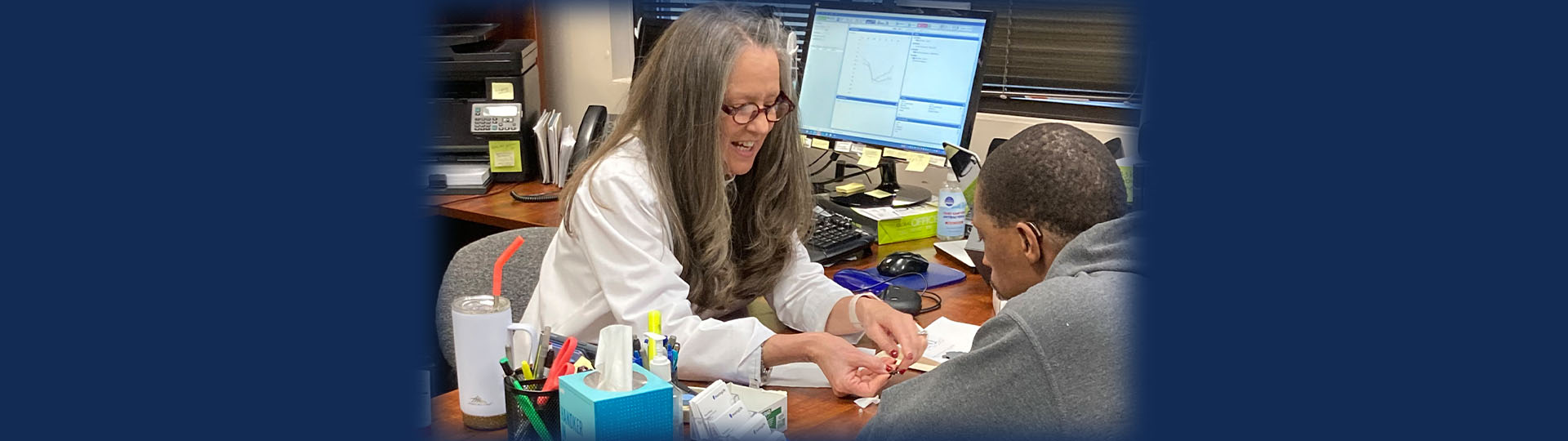 Hearing Care Specialist assisting a man in choosing hearing aids at HearingLife.