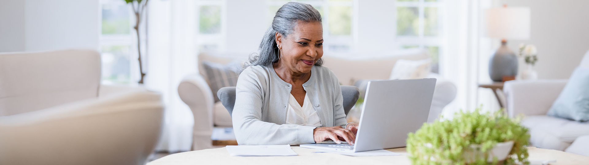 Woman sitting alone in front of laptop
