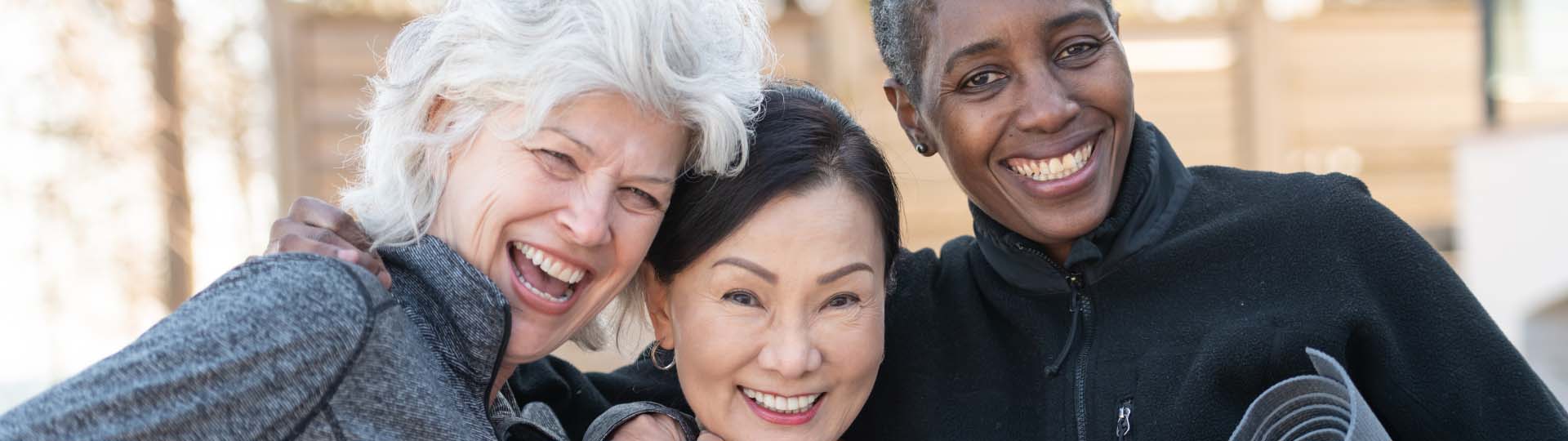 older adults smiling and enjoying time outdoors