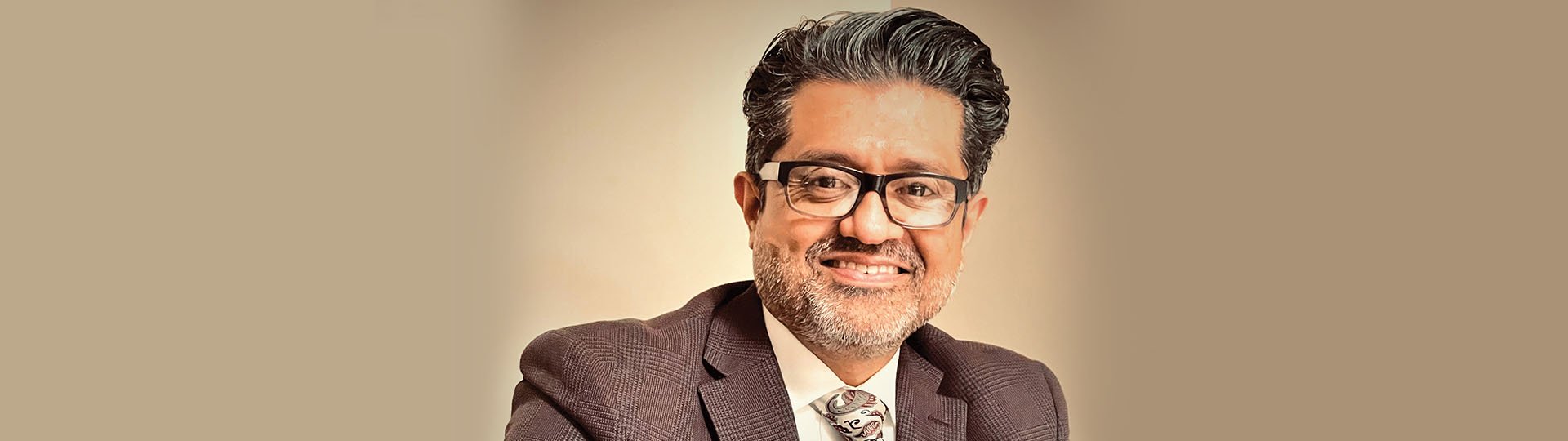 Mario Mendez, hearing care specialist in professional attire.