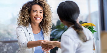 greeting a hearing care professional in a clinic setting