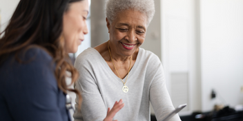 Audiologist discussing hearing test results with patient
