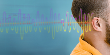 ear fitted with a hearing aid and vibrant sound waves representing auditory perception