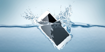smartphone falling into water, surrounded by splashes