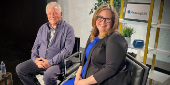 I don't know who they are. Seated in a professional studio setting featuring HearingLife branding.