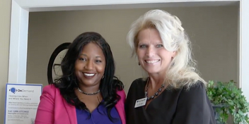 Sydney Holman with an audiologist at a hearing care clinic.