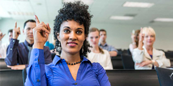 group participating in sign language lesson in a classroom setting
