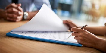 filling out paperwork for disability benefits due to hearing loss