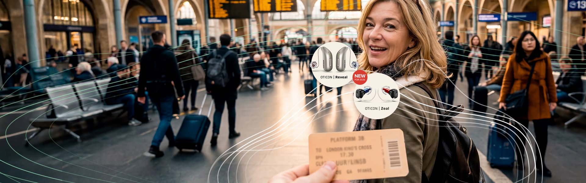 NEW Oticon Reveal™ and Oticon Zeal™ hearing aids and Woman wearing Reveal™ hearing aids, smiling in a train station