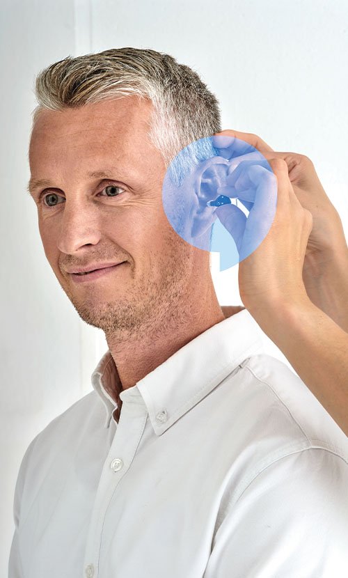 Man wearing the NEW Oticon Zeal hearing aid