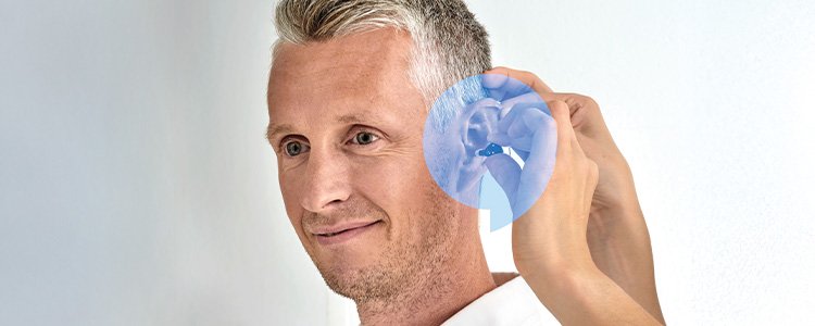 Man wearing the NEW Oticon Zeal™ hearing aid