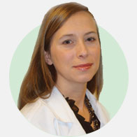 Bobbie McCue, hearing care specialist wearing a white coat.