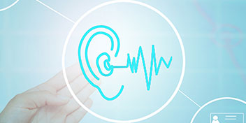 Hearing test icon with an ear and soundwave inside a circular graphic