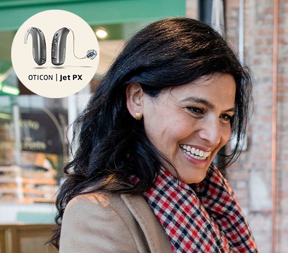Oticon Jet PX™ hearing aid on a smiling woman