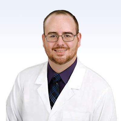 Alexander Huse, hearing care specialist in professional attire.