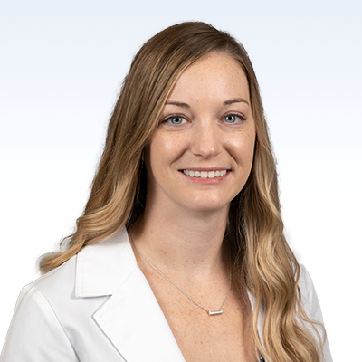 alison jarrett, hearing care professional wearing a white coat