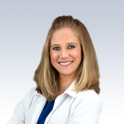 alyssa rech, hearing care specialist in a white coat