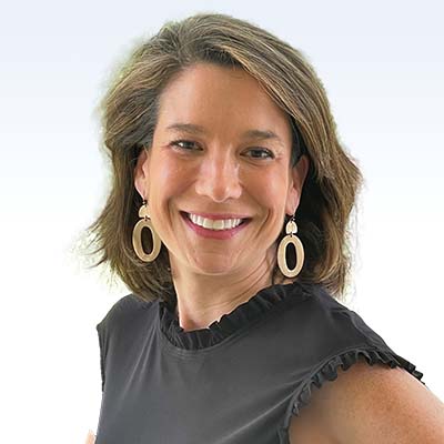 Christiana Rose, hearing care specialist, wearing a black ruffled top with gold earrings against a gradient background.