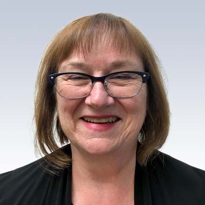 cindy brown, hearing care professional with shoulder-length brown hair and a black blazer