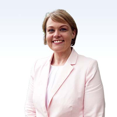 dana jurado, hearing care specialist in a light pink blazer
