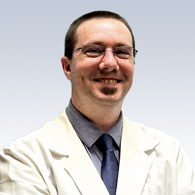 hearing care specialist in a white coat with a blurred face