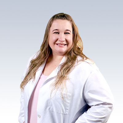 hearing care specialist wearing a white lab coat