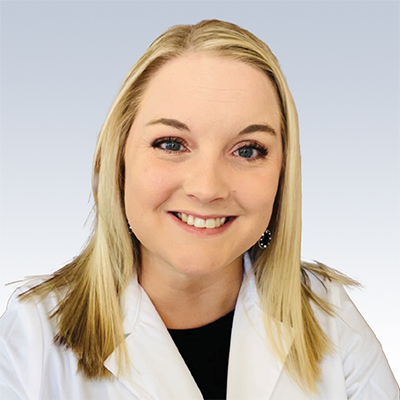 Emily Wayer, hearing care specialist wearing a white lab coat.