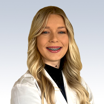 Gabriella Leclerc, hearing care specialist in a white coat.