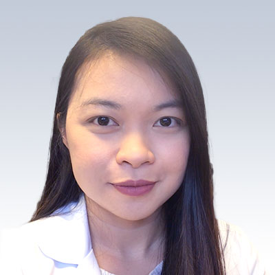 Ivy Daep, hearing care professional with long dark hair and a white coat, against a light gradient background.