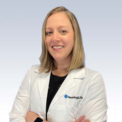 HearingLife hearing care professional in a white lab coat.
