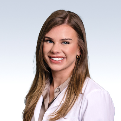 Jessica Wesaw, hearing care professional wearing a white coat.