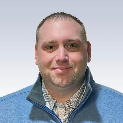 joshua beach, hearing care specialist wearing a blue jacket