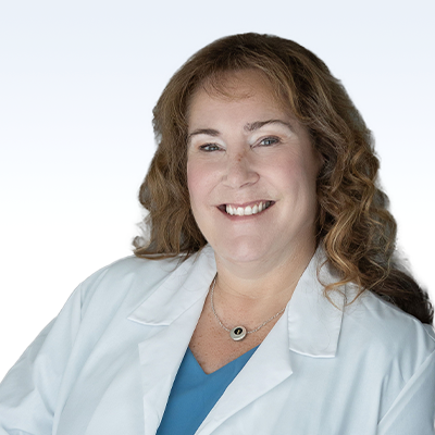 kristine spencer abbott, hearing care professional in a white lab coat