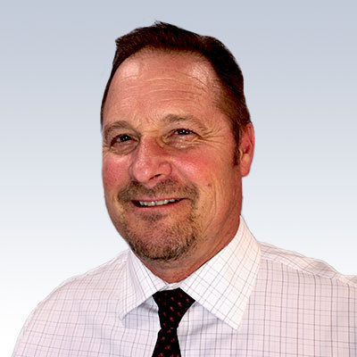 Kurt Anderson, hearing care professional in formal attire